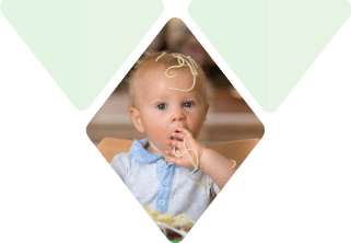 Child covered in spaghetti