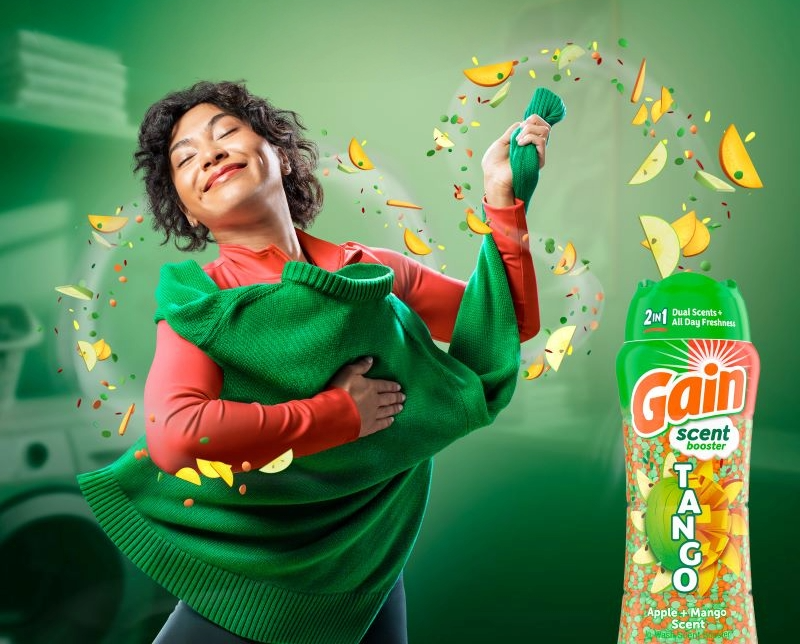 woman holding sweater Gain tango scent